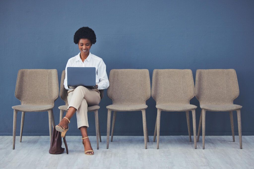 Woman sitting with laptop