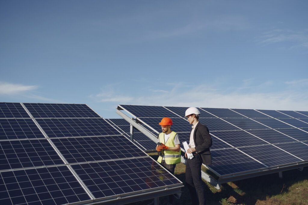 Workers on solar panel