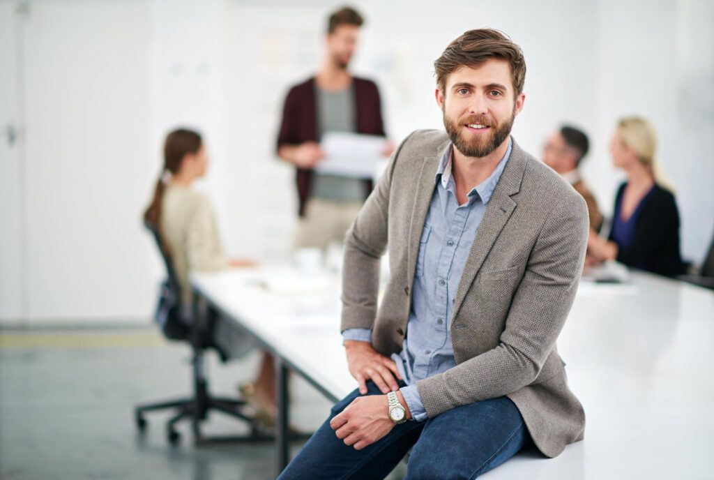 Business man sitting on table